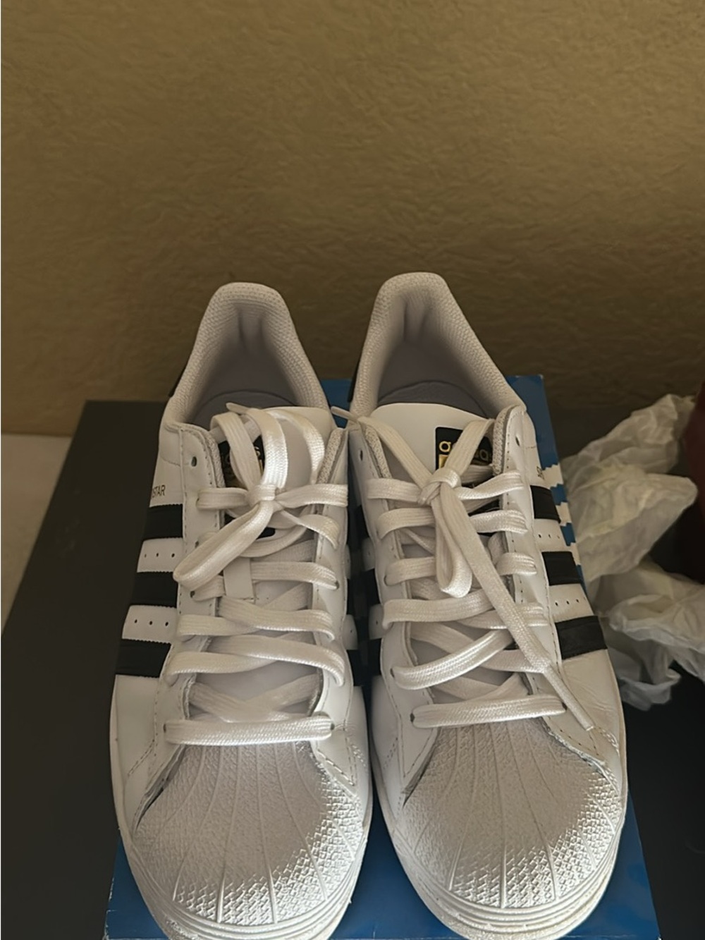 adidas Superstar white and black sneakers